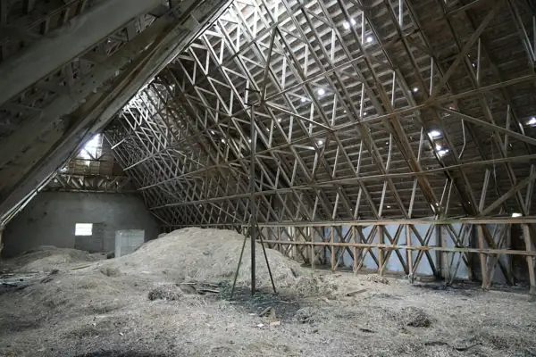 Attic floor covered with a thick layer of blown-in insulation