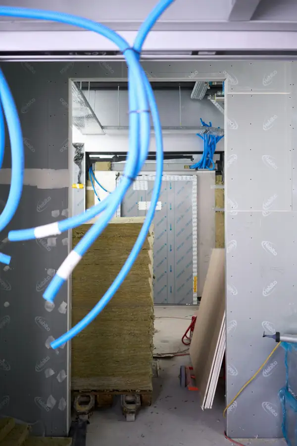 Mineral wool insulation and new utility lines in a renovation