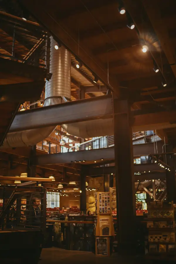Exposed spiral ductwork in a restaurant ceiling