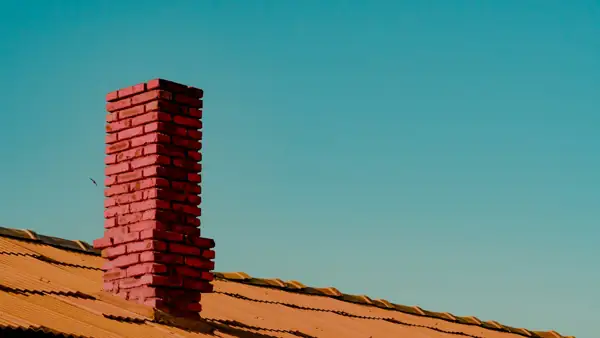 Brick chimney against a clear sky