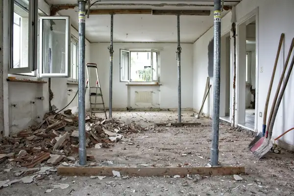 Room stripped down with temporary supports during renovation