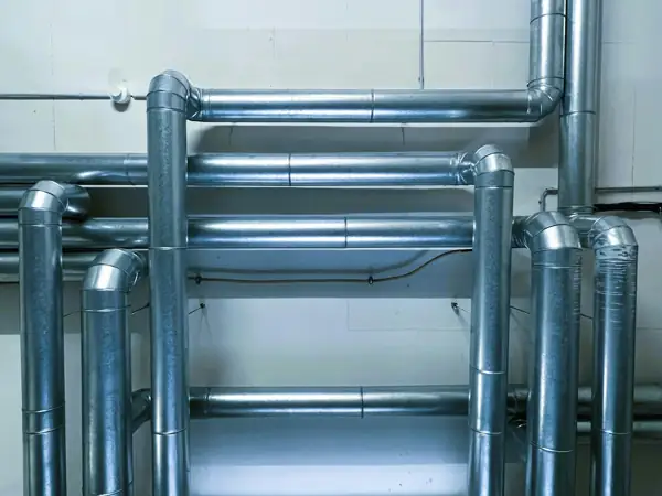 Insulated metal piping in a mechanical room