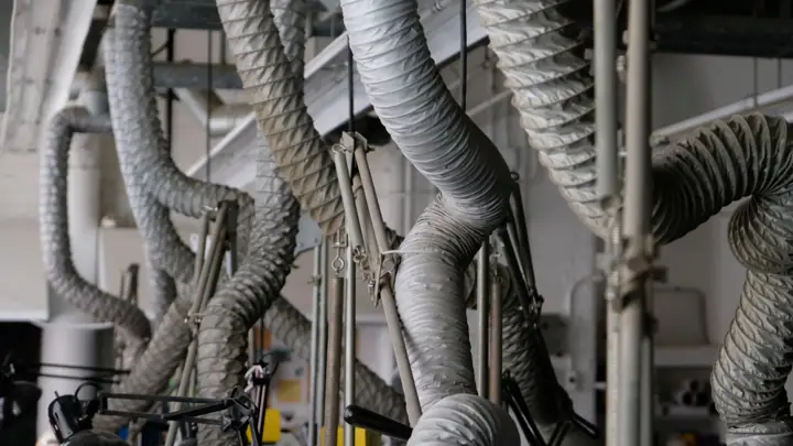 Flexible air ducts in a ceiling cavity