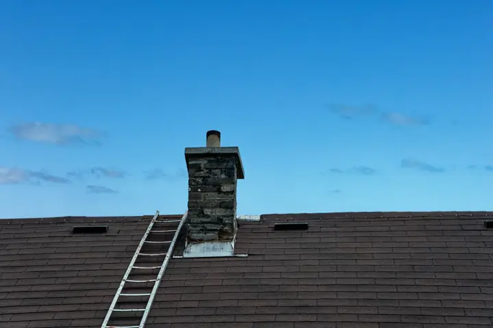 Chimney on a shingled roof
