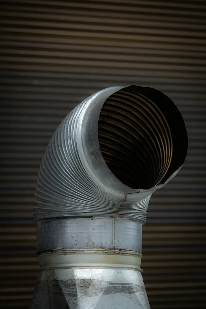 Close-up of a round flexible metal duct opening